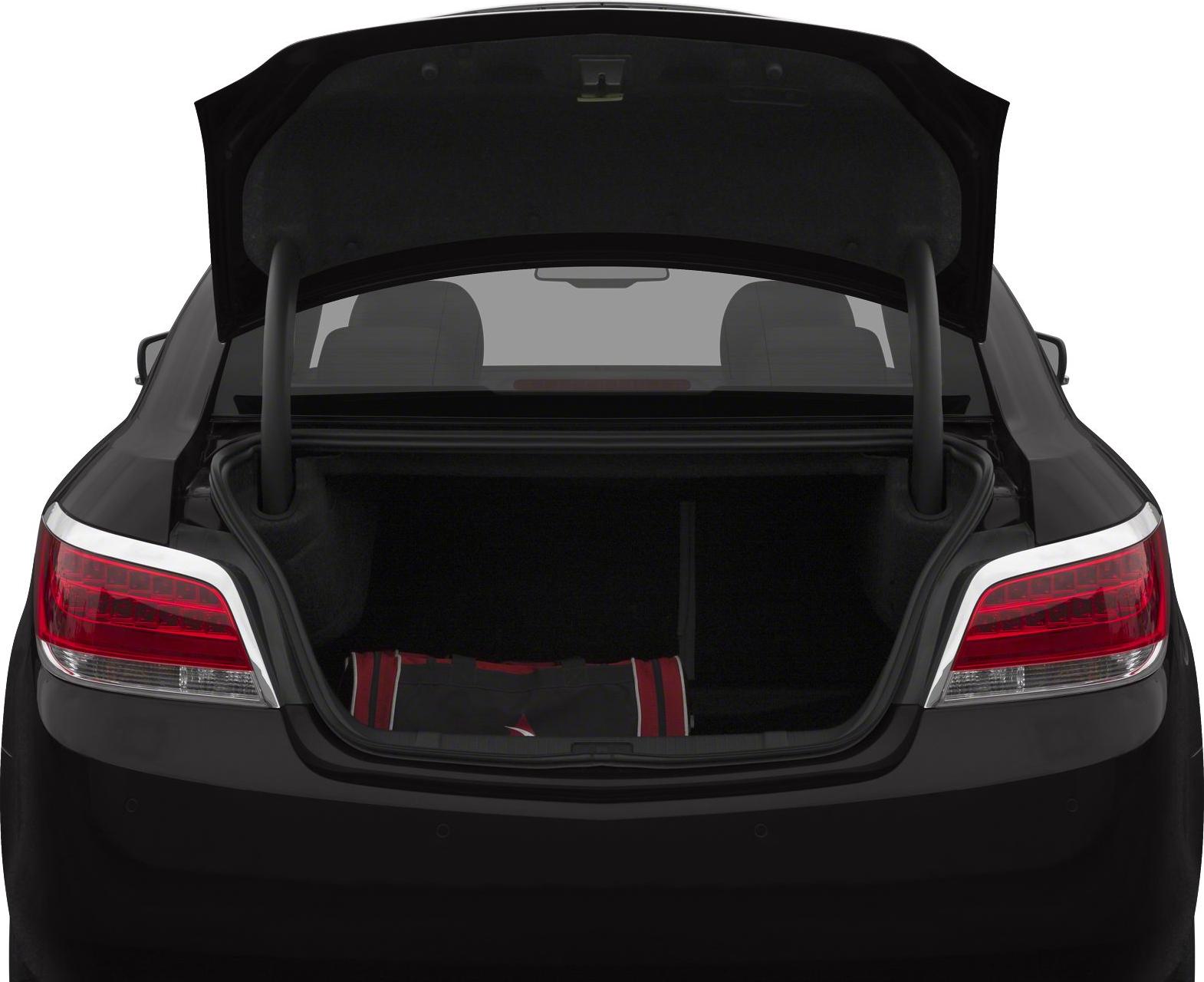 Open rear trunk and tail lights of a sedan.