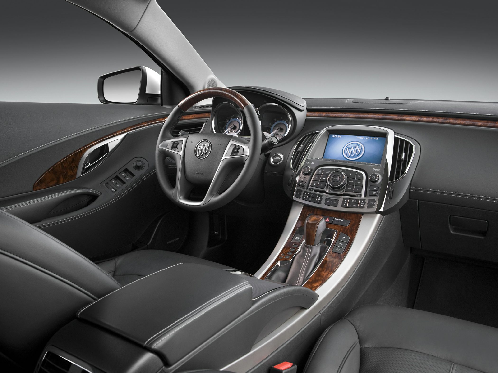 Leather seats, wood trim, console controls, steering wheel, infotainment display