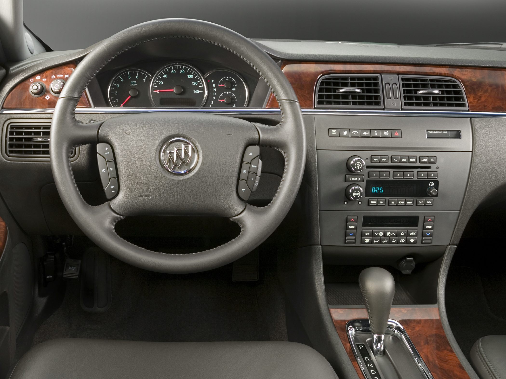 Dashboard, steering wheel, wood trim, and gear shift details