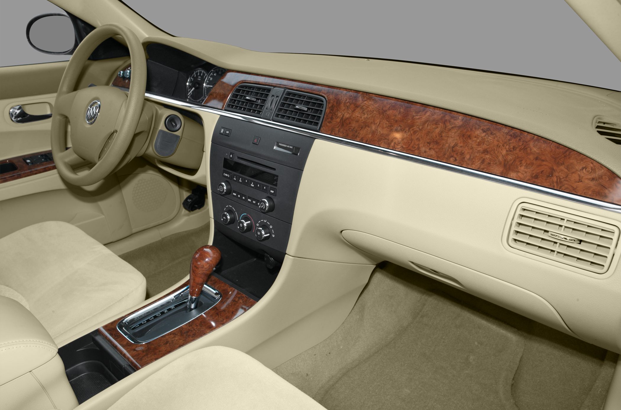 Beige interior with wood trim and automatic gear shift