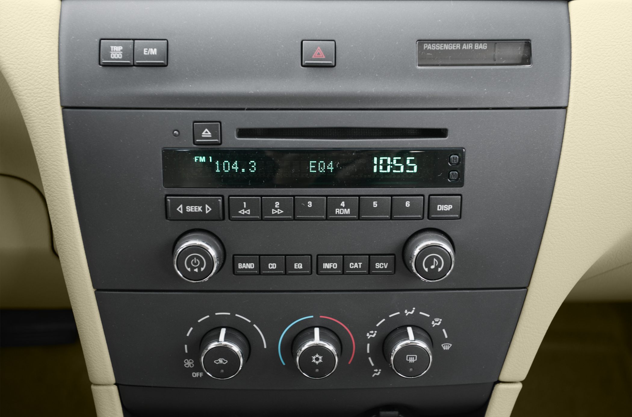 Car audio system with radio display and climate control knobs