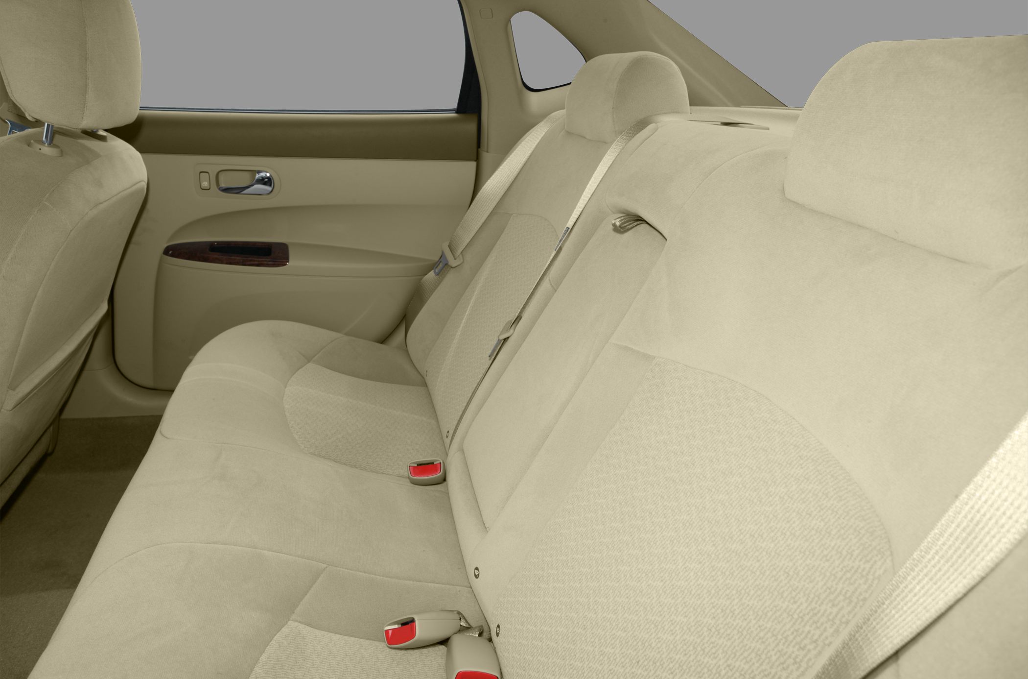 Beige fabric rear seats with seatbelts and wood trim door panel