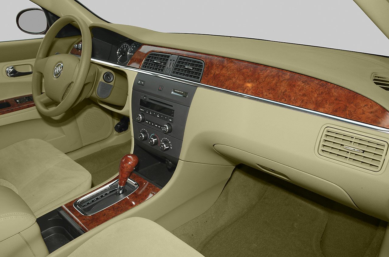 Wood trim dashboard and beige interior with automatic gear shift
