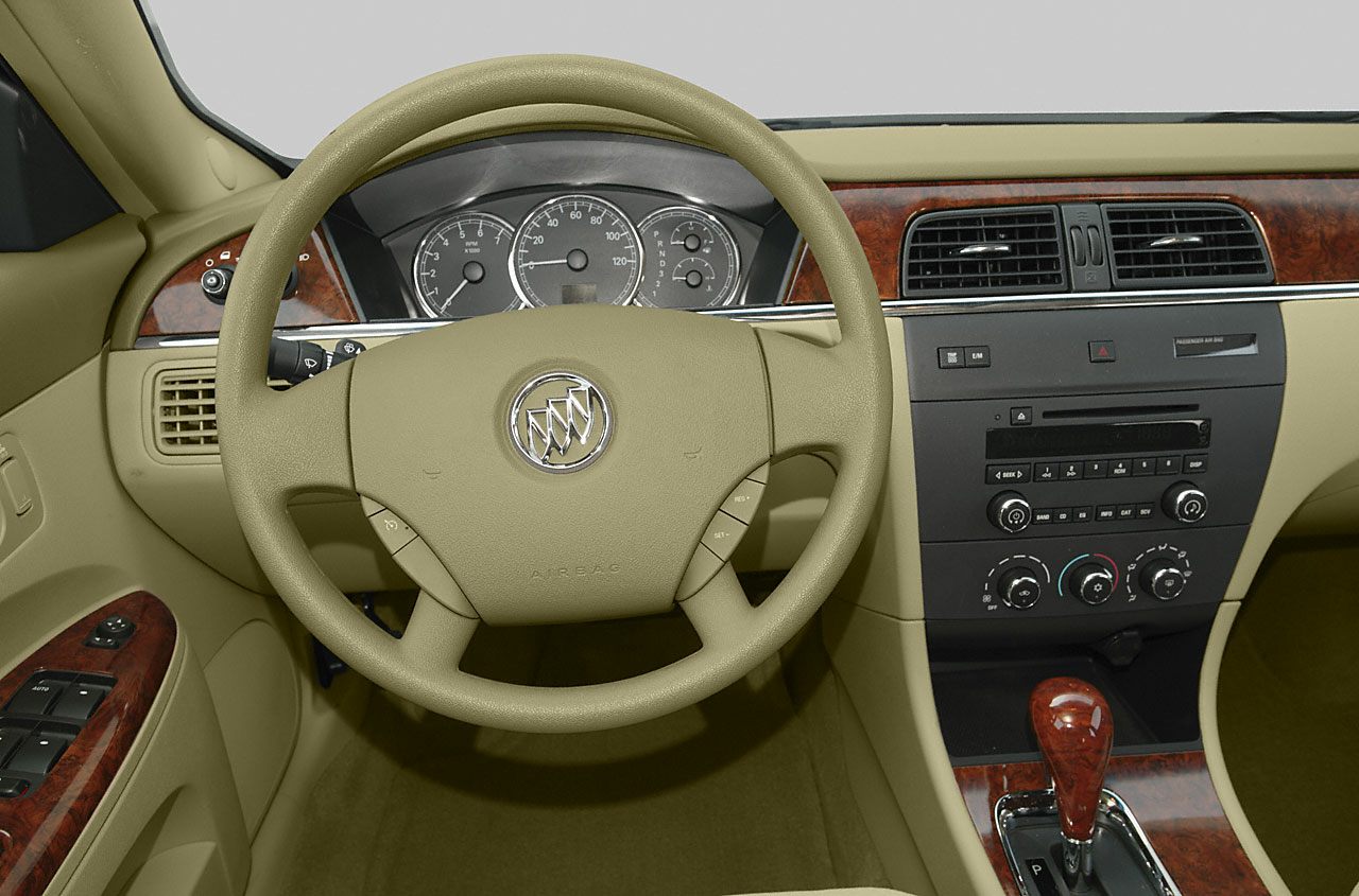 Steering wheel and dashboard with instrument cluster and center console wood trim