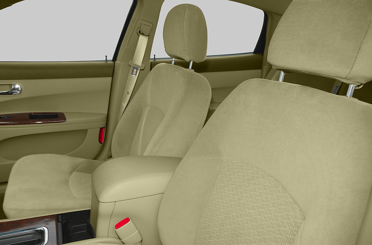 Beige fabric front seats and door panel with armrest and seatbelt