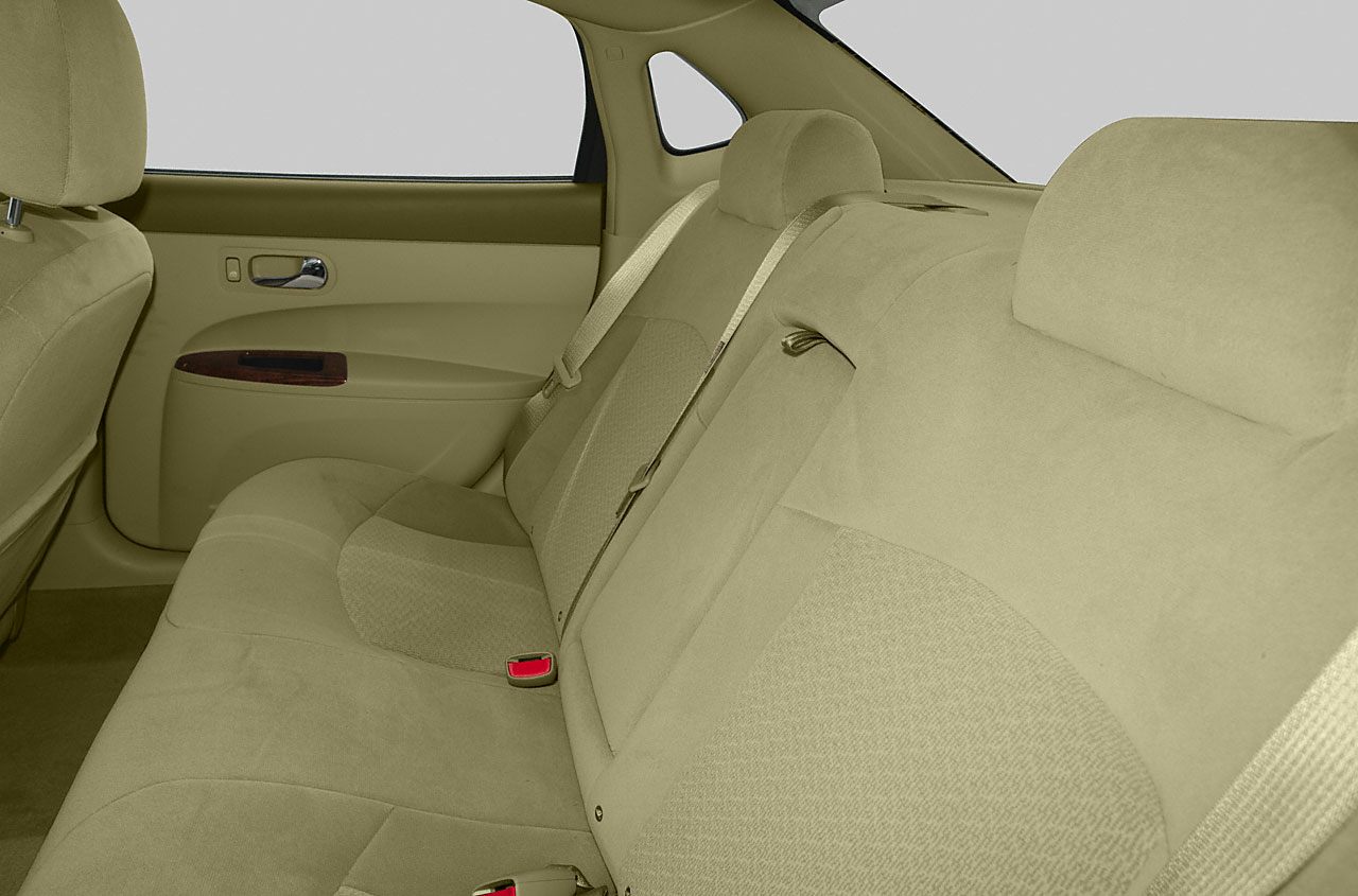 Fabric upholstery rear seat with seatbelts and door handle