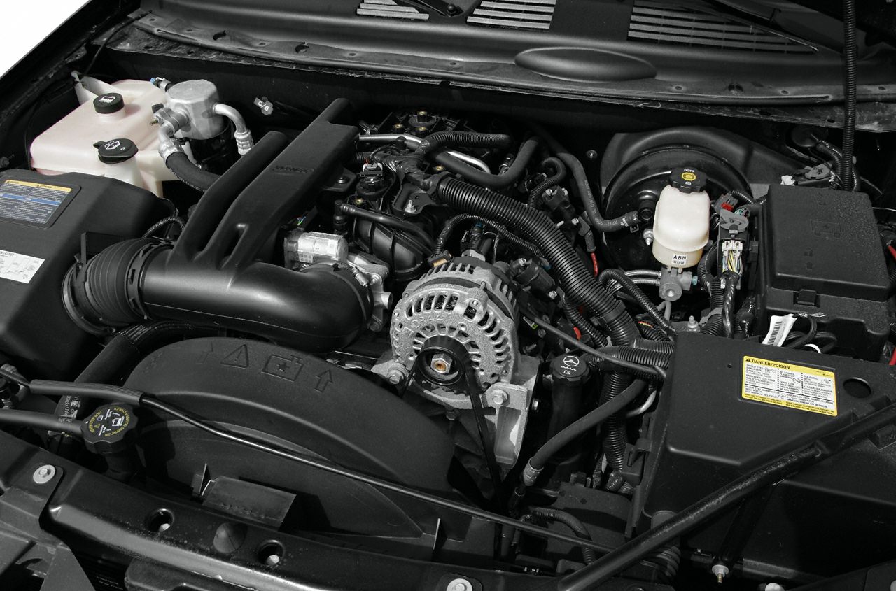 Detailed engine bay showcasing alternator, hoses, and fluid reservoirs