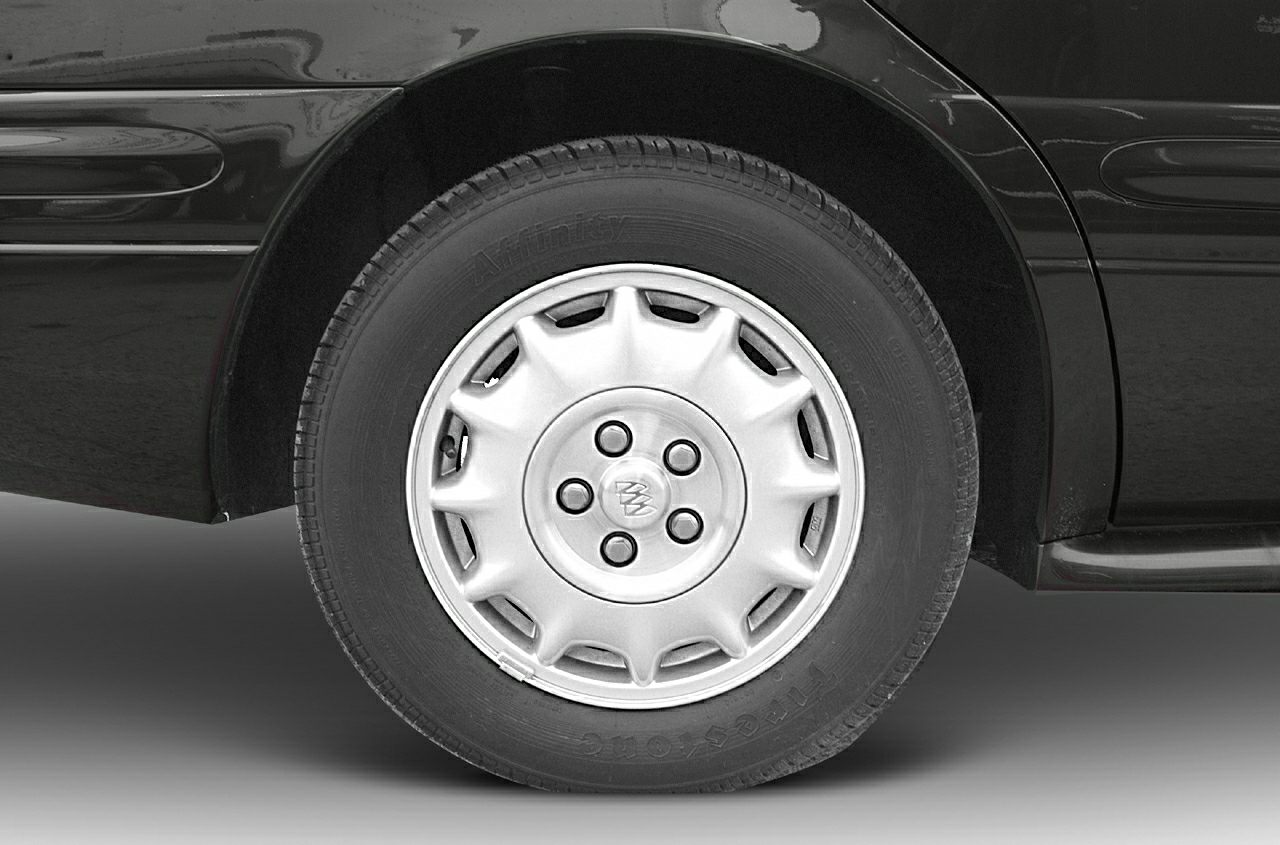 Alloy wheel and tire close-up with detailed rim design and tire tread