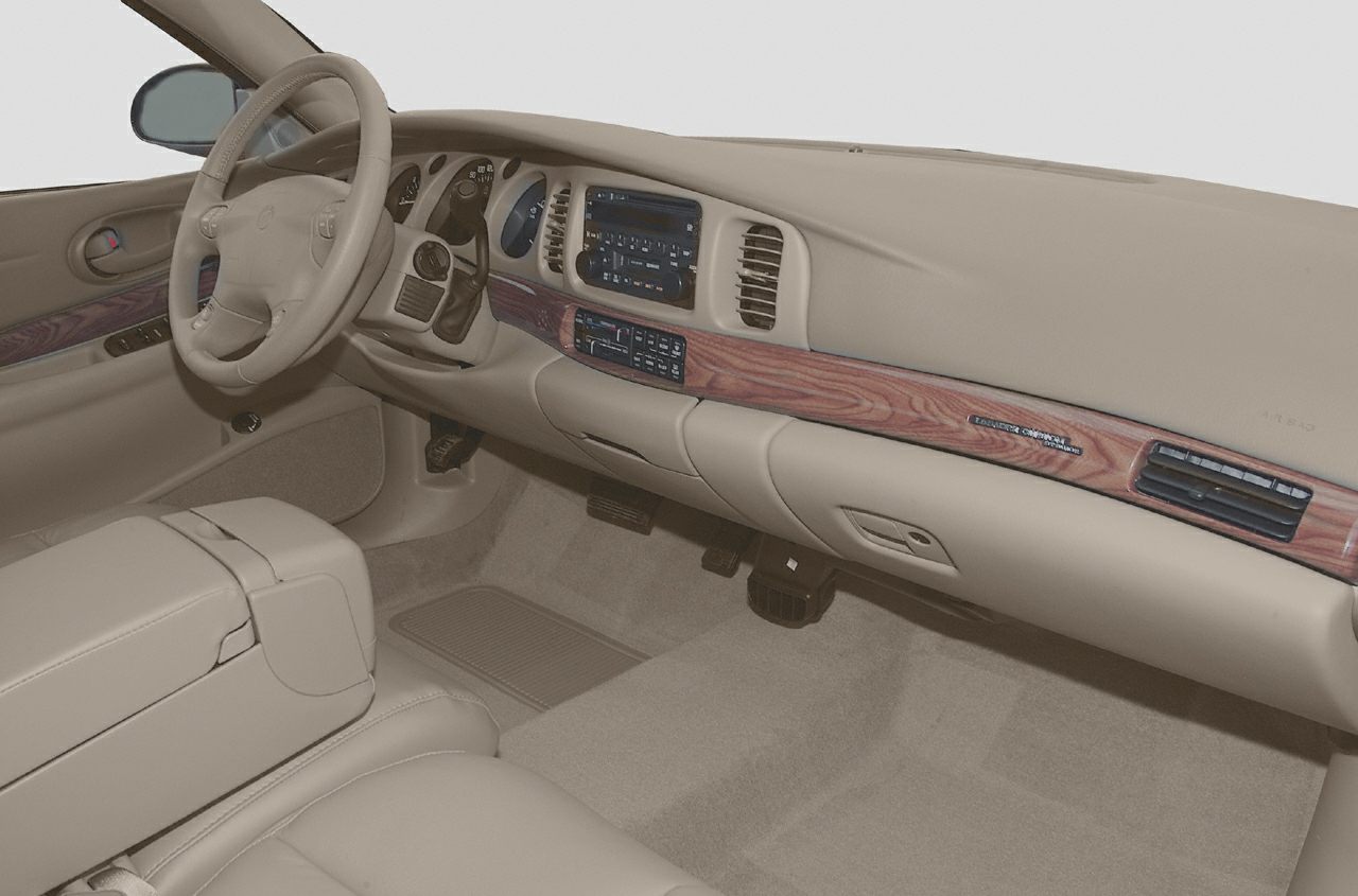 Beige leather interior with wood trim dashboard and steering wheel