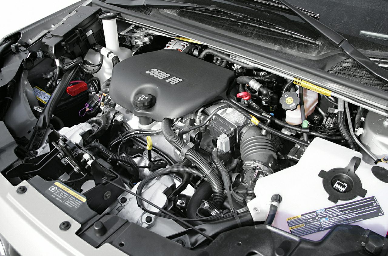 3500 V6 engine with visible oil cap and coolant reservoir in a car engine bay