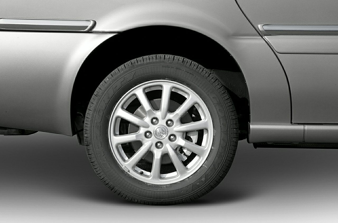 Alloy wheel with detailed rim design and tire tread close-up