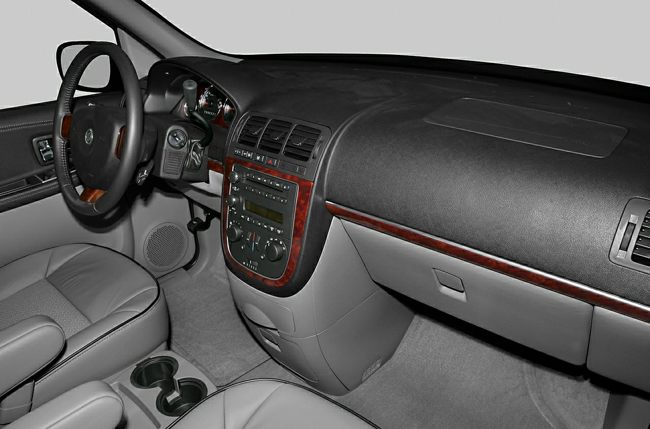 Dashboard and steering wheel with wood trim and center console controls