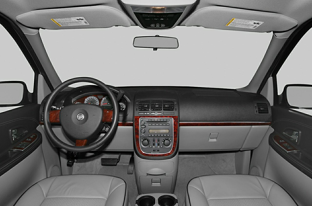 Steering wheel and dashboard with wood trim and control panel