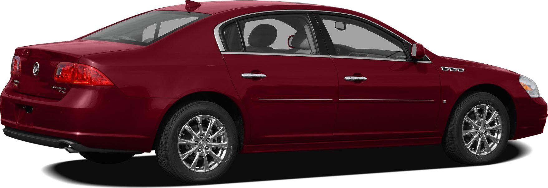 Side profile of a sedan with chrome multi-spoke wheels and rear spoiler