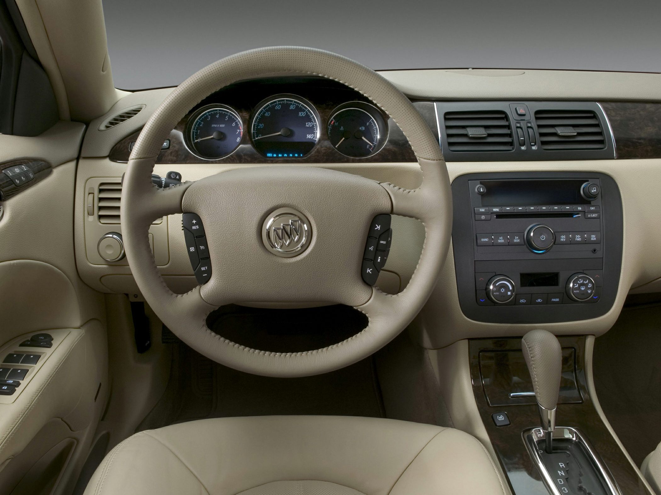 Steering wheel and dashboard with center console in beige interior