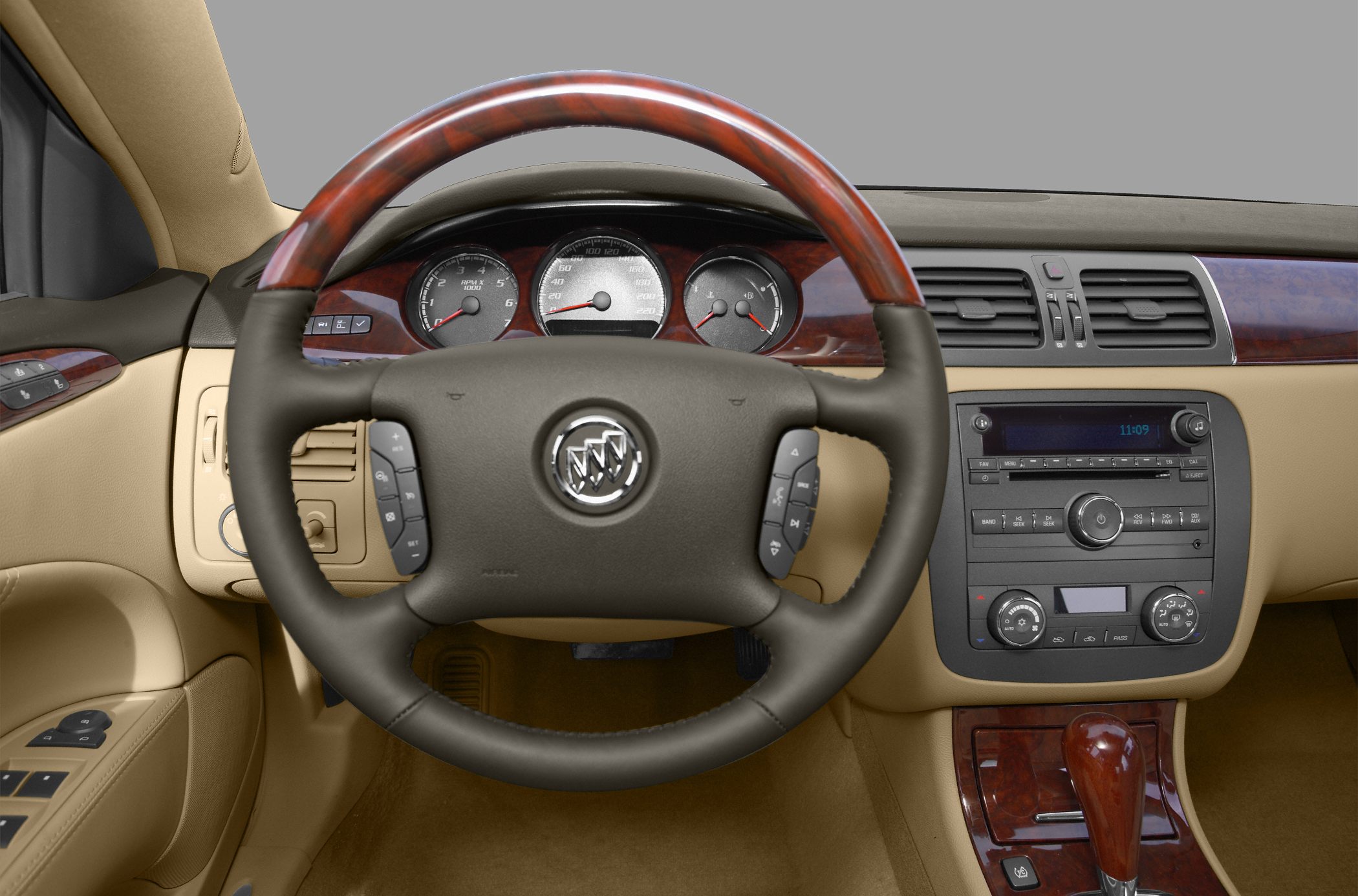 Wood-trimmed steering wheel and detailed dashboard controls