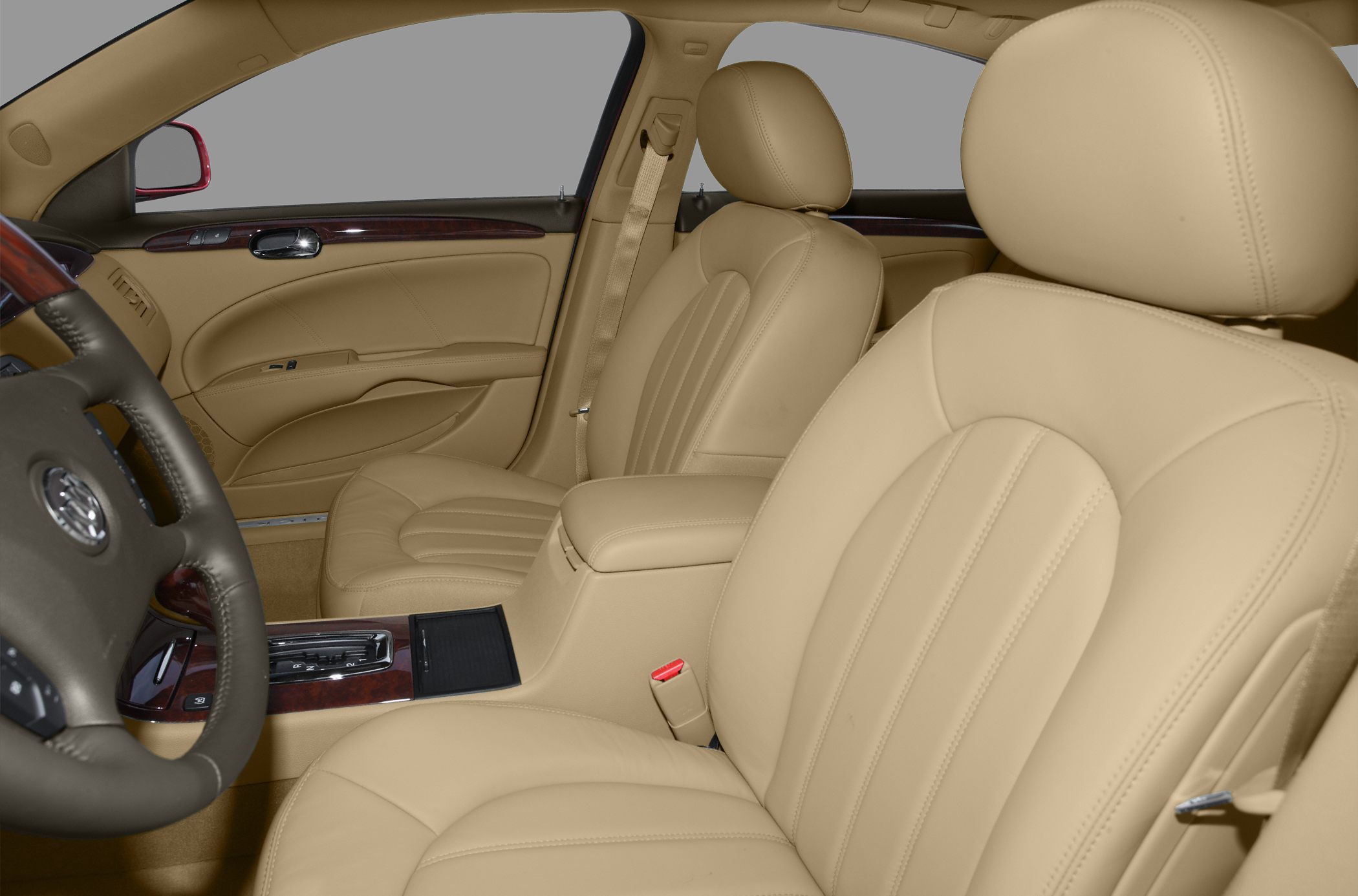 Beige leather front seats with wood trim and center console