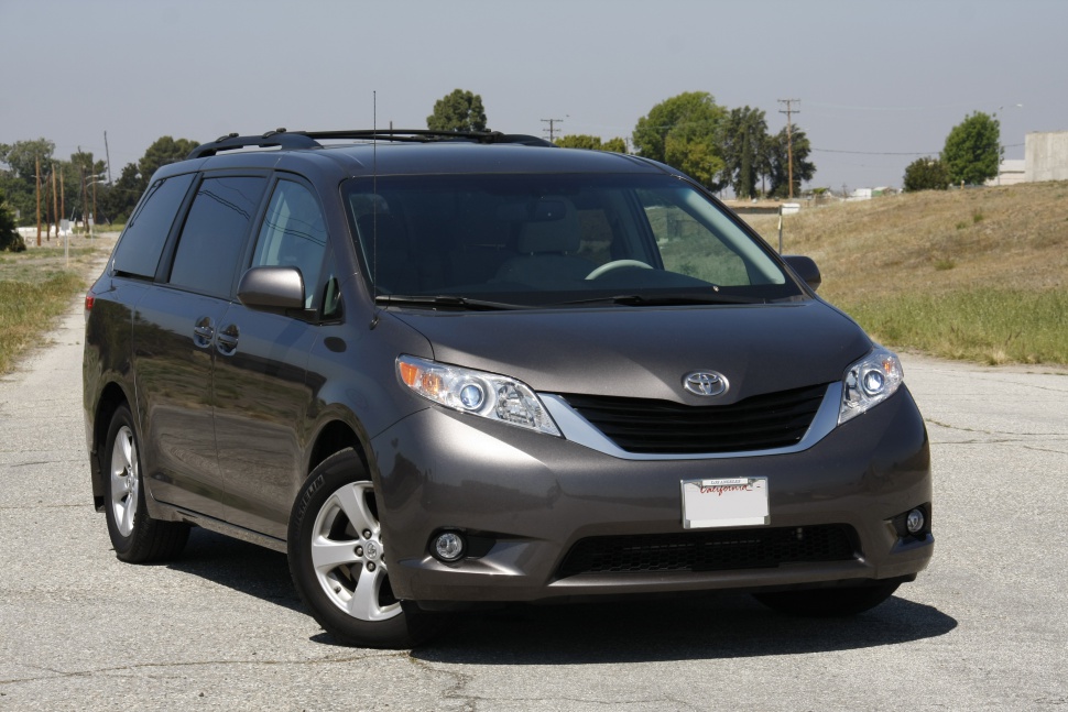 Front view with sleek headlights and grille of a minivan