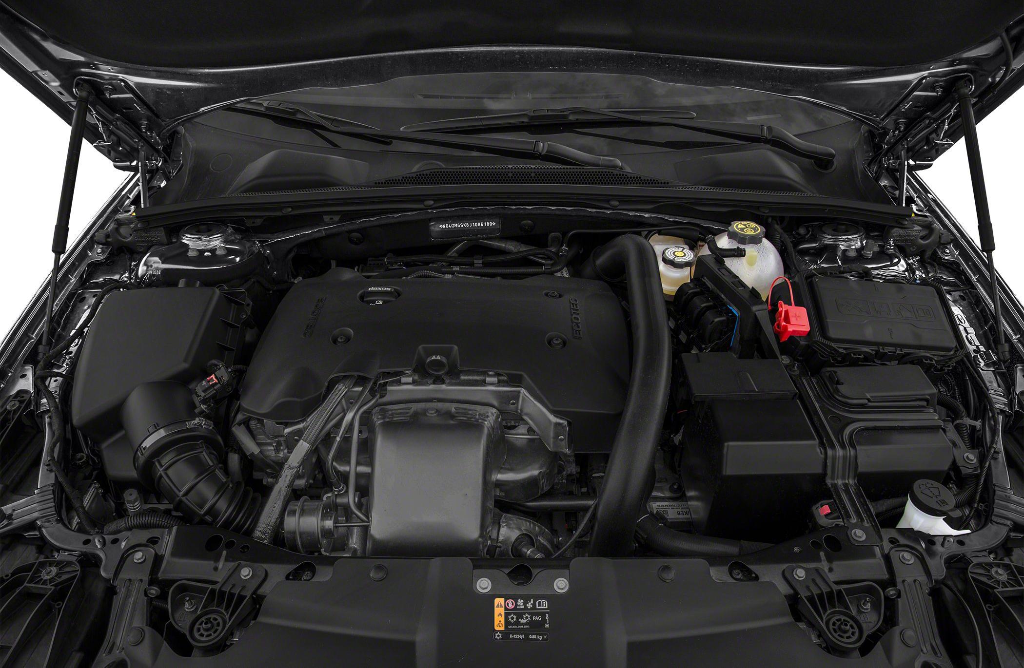 Engine bay with engine cover, air intake, and fluid reservoirs