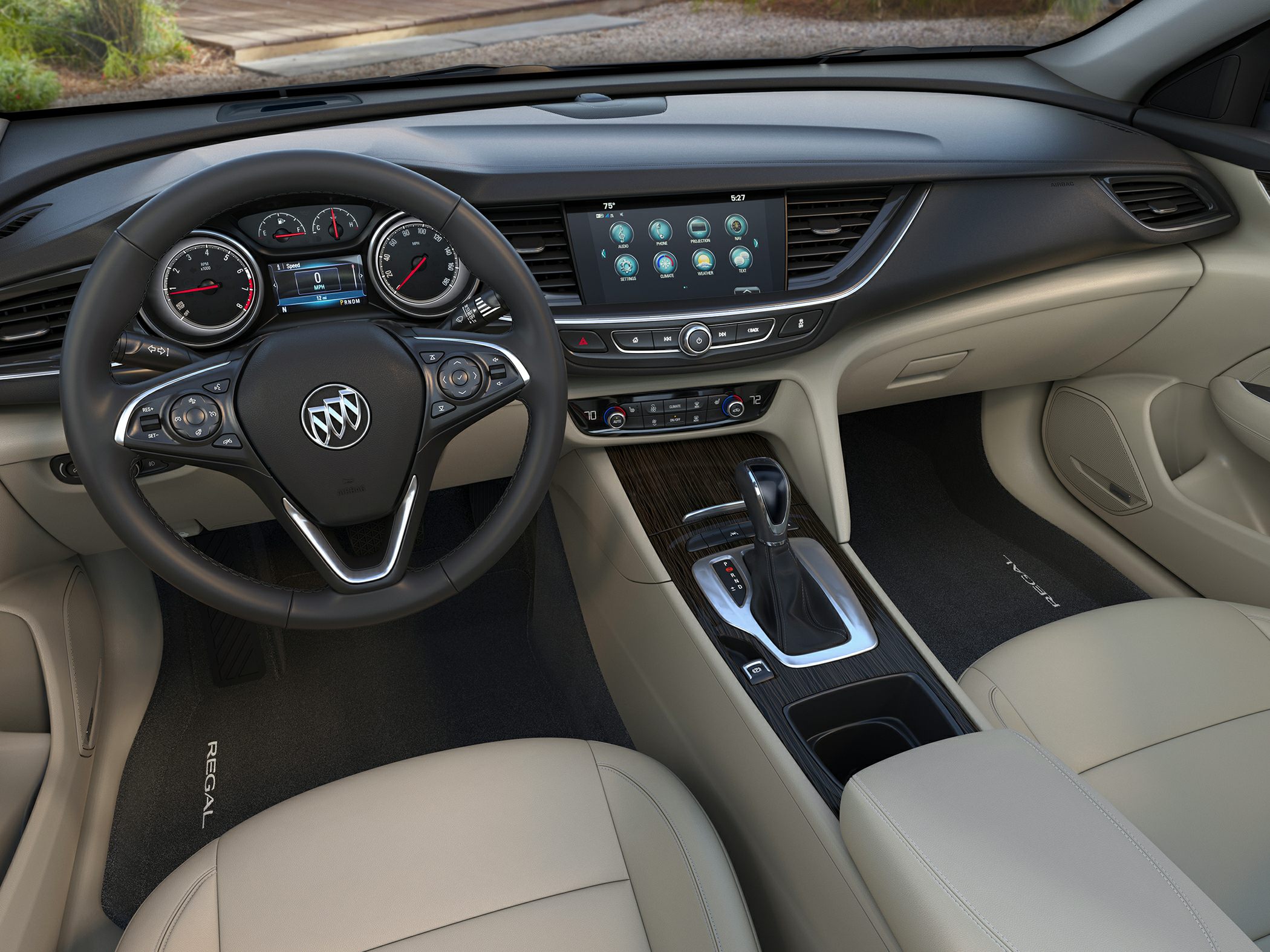 Steering wheel, dashboard, infotainment, and center console of a car interior
