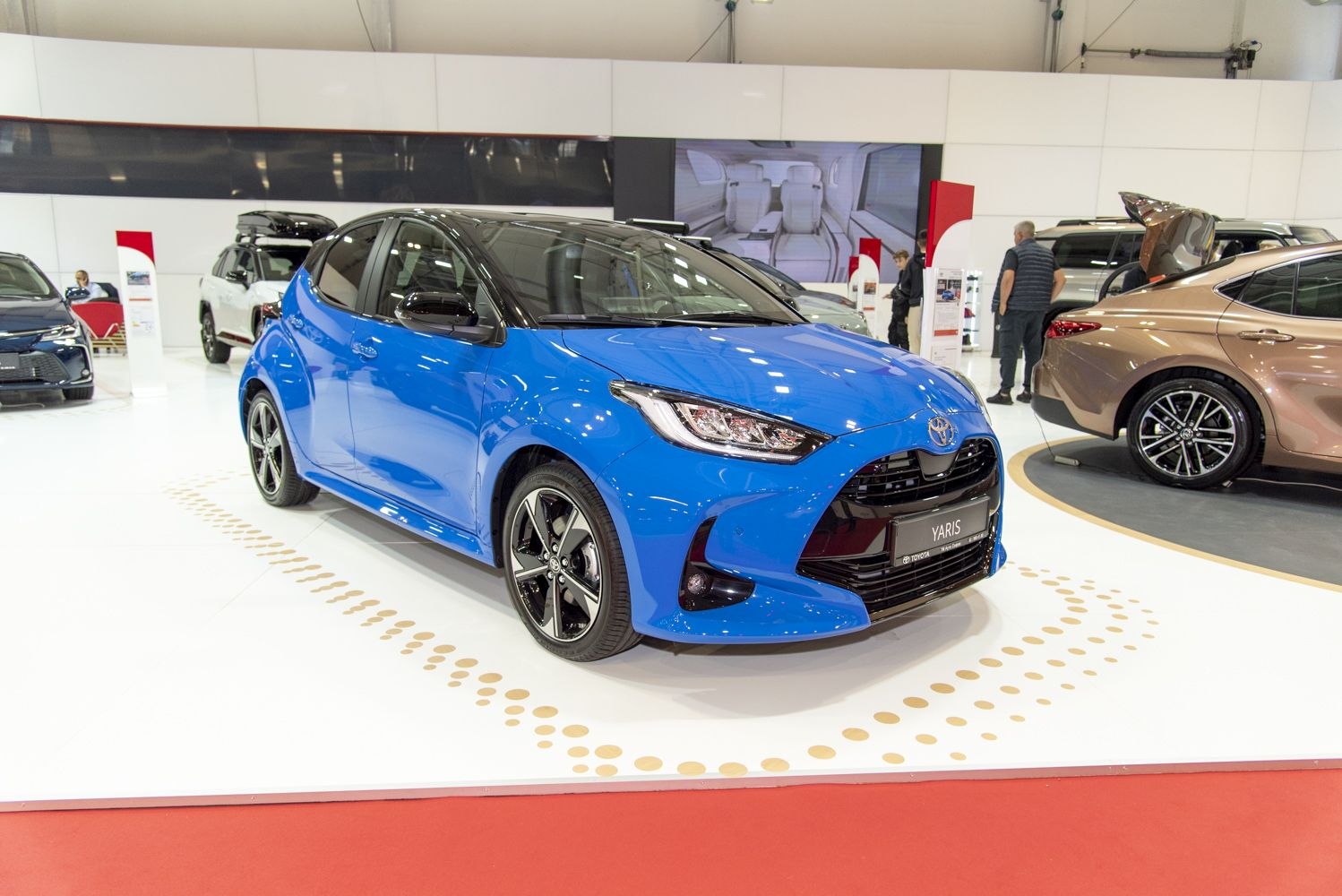 Sporty front and side view of a blue hatchback car