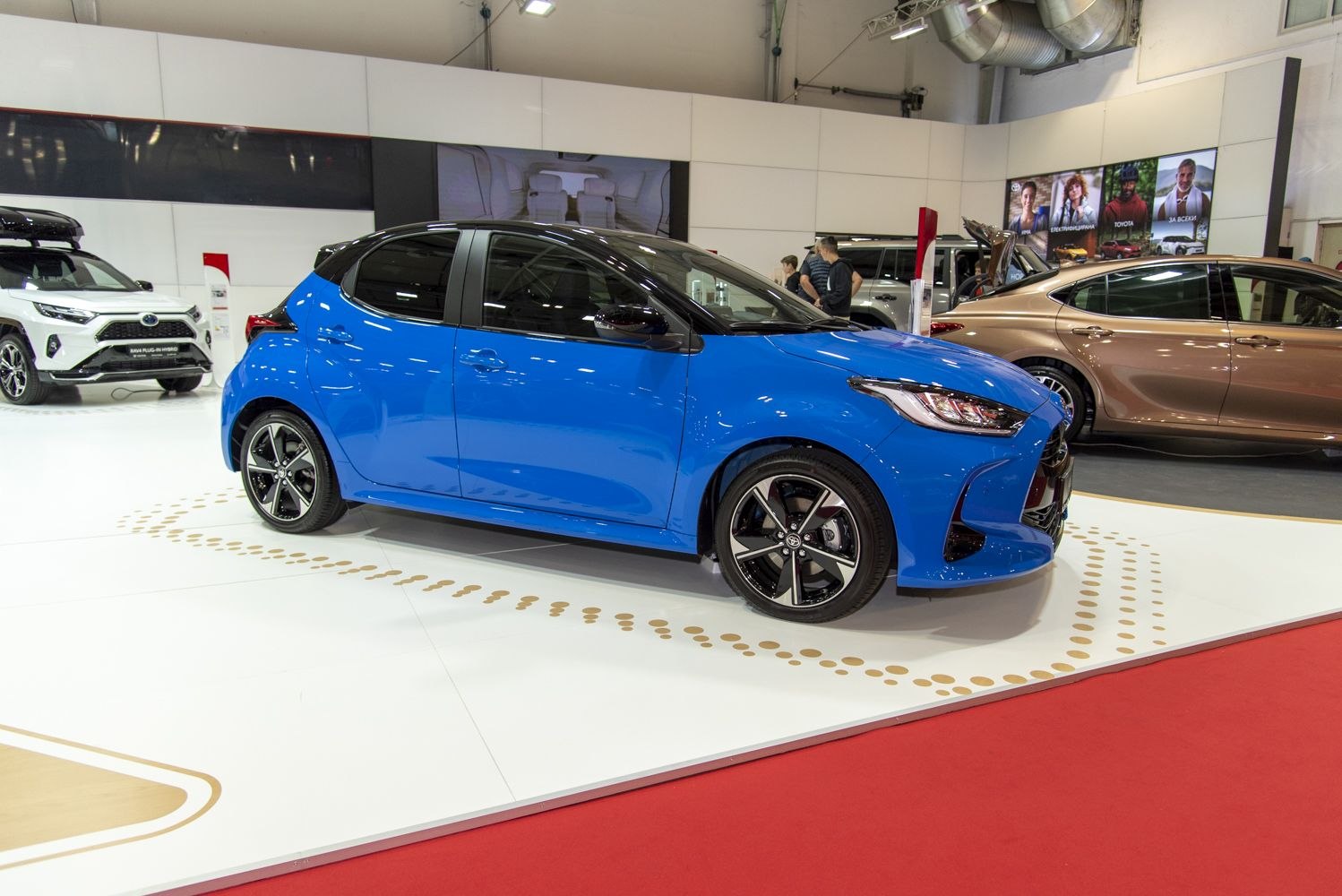 Compact modern hatchback with sporty wheels and two-tone paint