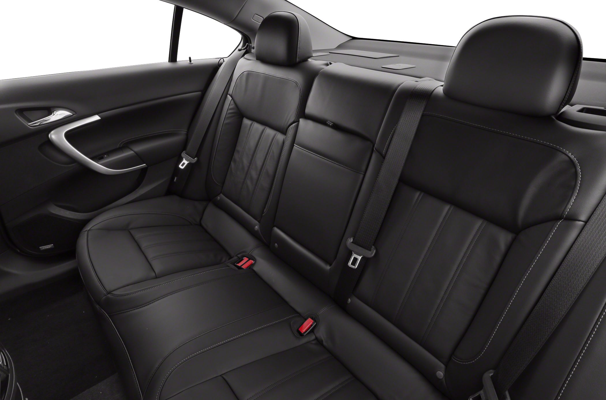 Rear black leather seats with seat belts and headrests in a sedan.