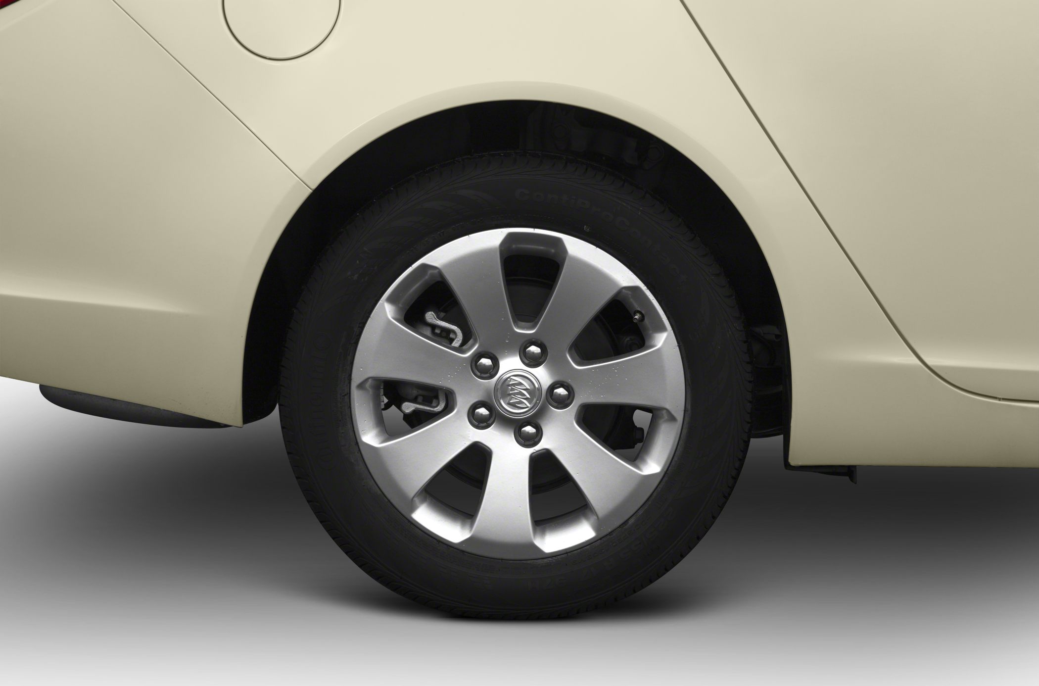 Alloy wheel and tire close-up on a car's rear side.