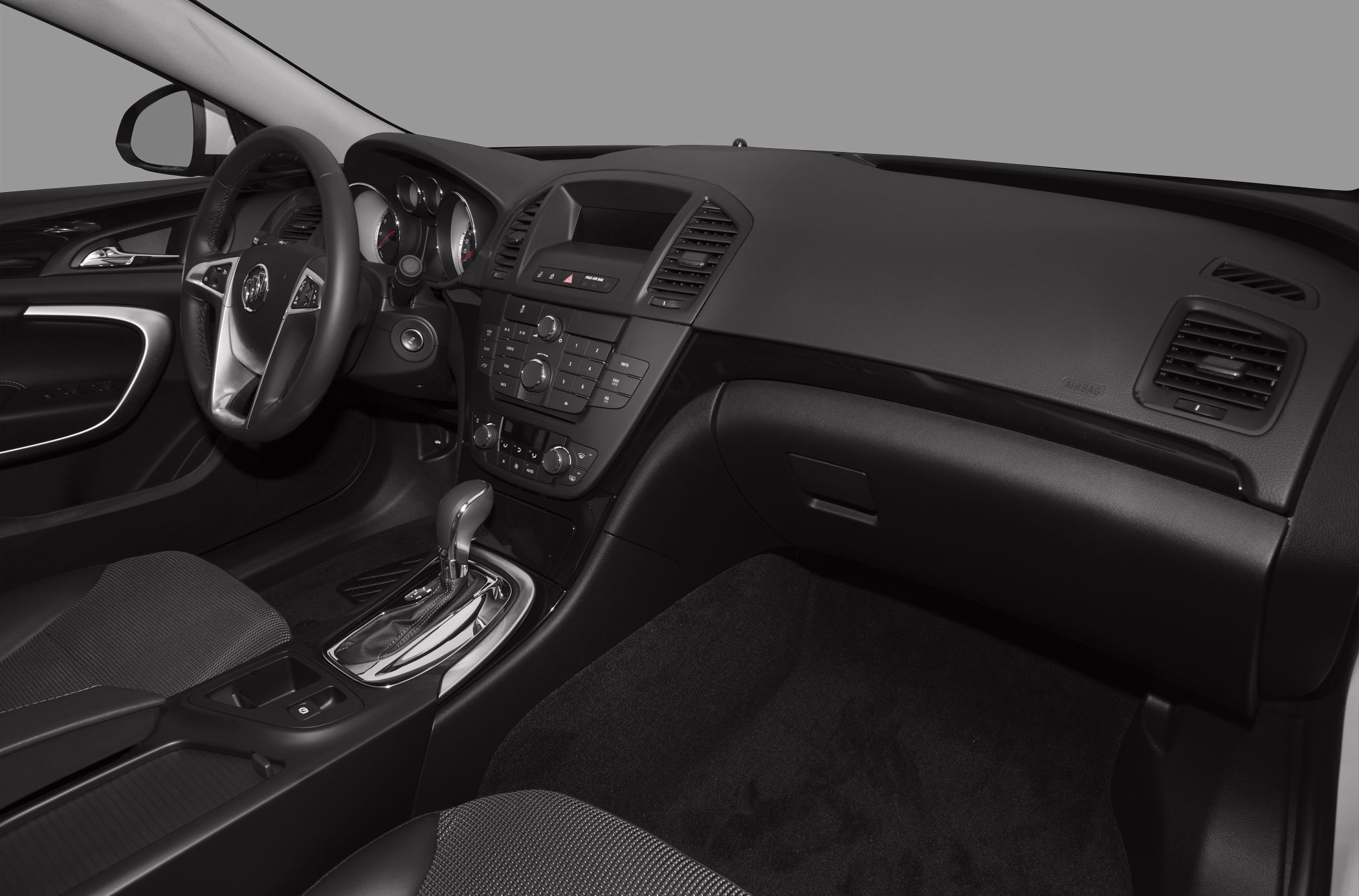Interior dashboard with steering wheel and center console featuring gear shifter