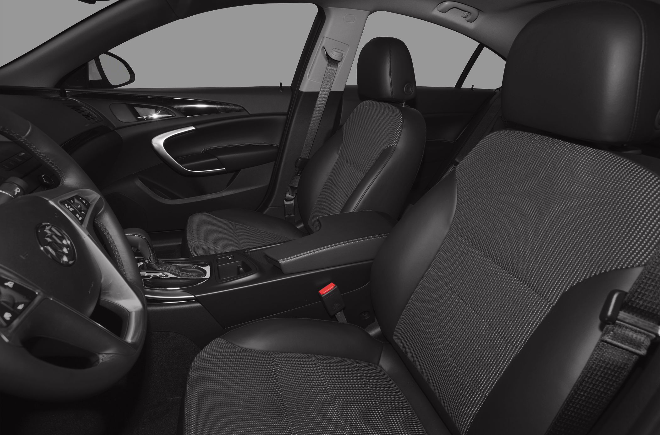 Sedan front interior with dual fabric and leather seats and center console