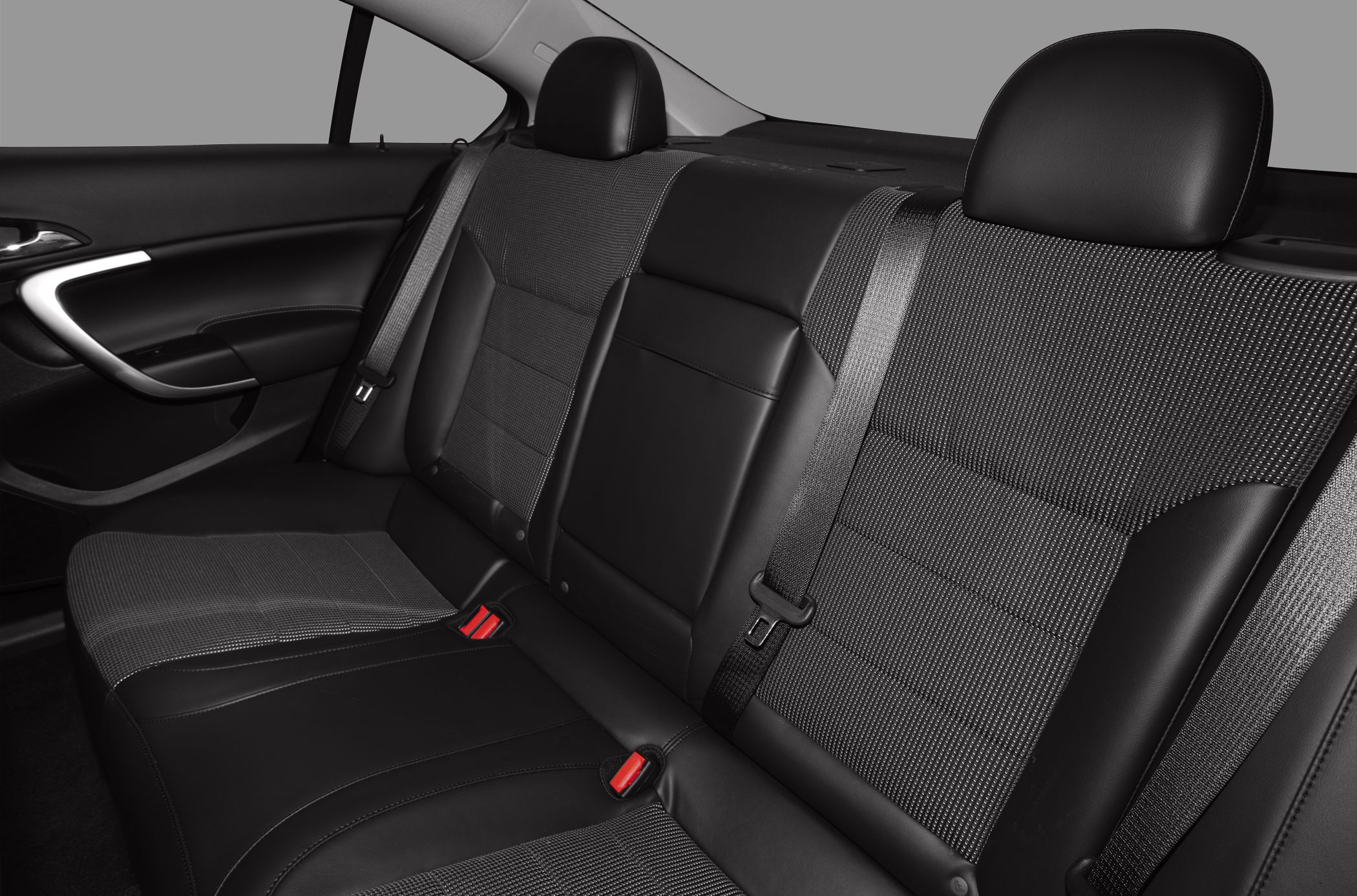 Rear seats with mixed cloth and leather upholstery, integrated headrests, and seat belts.
