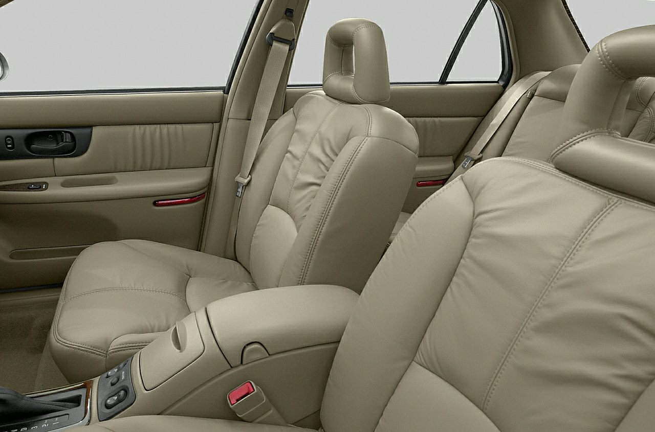 Beige leather front and rear seats with door panel