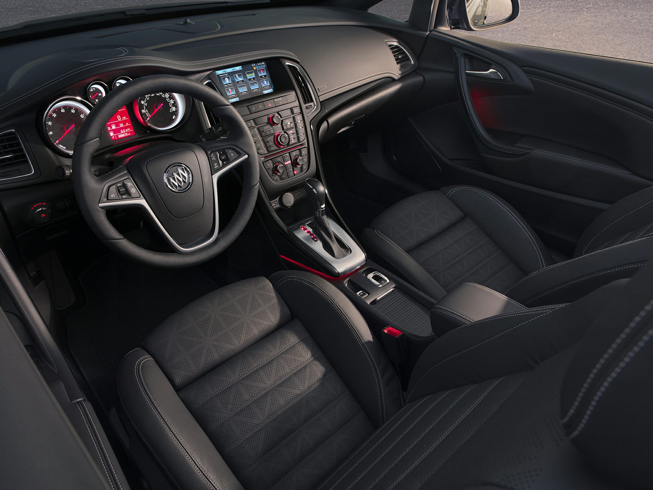 Car interior with dashboard, steering wheel, and premium seats