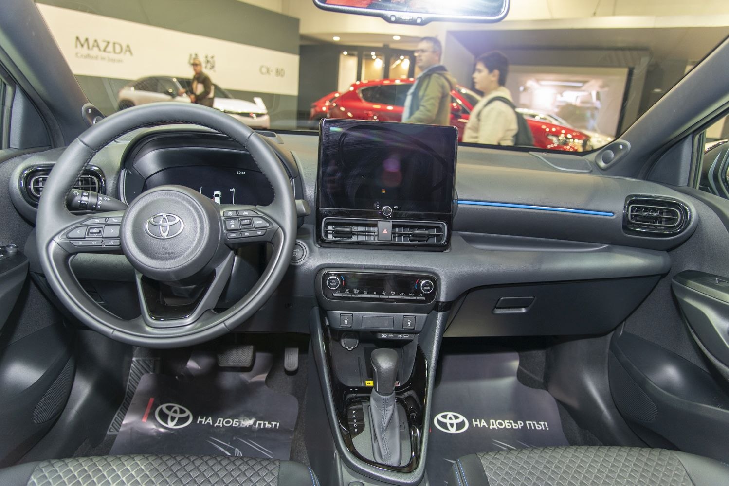 Interior dashboard with touchscreen and steering wheel controls