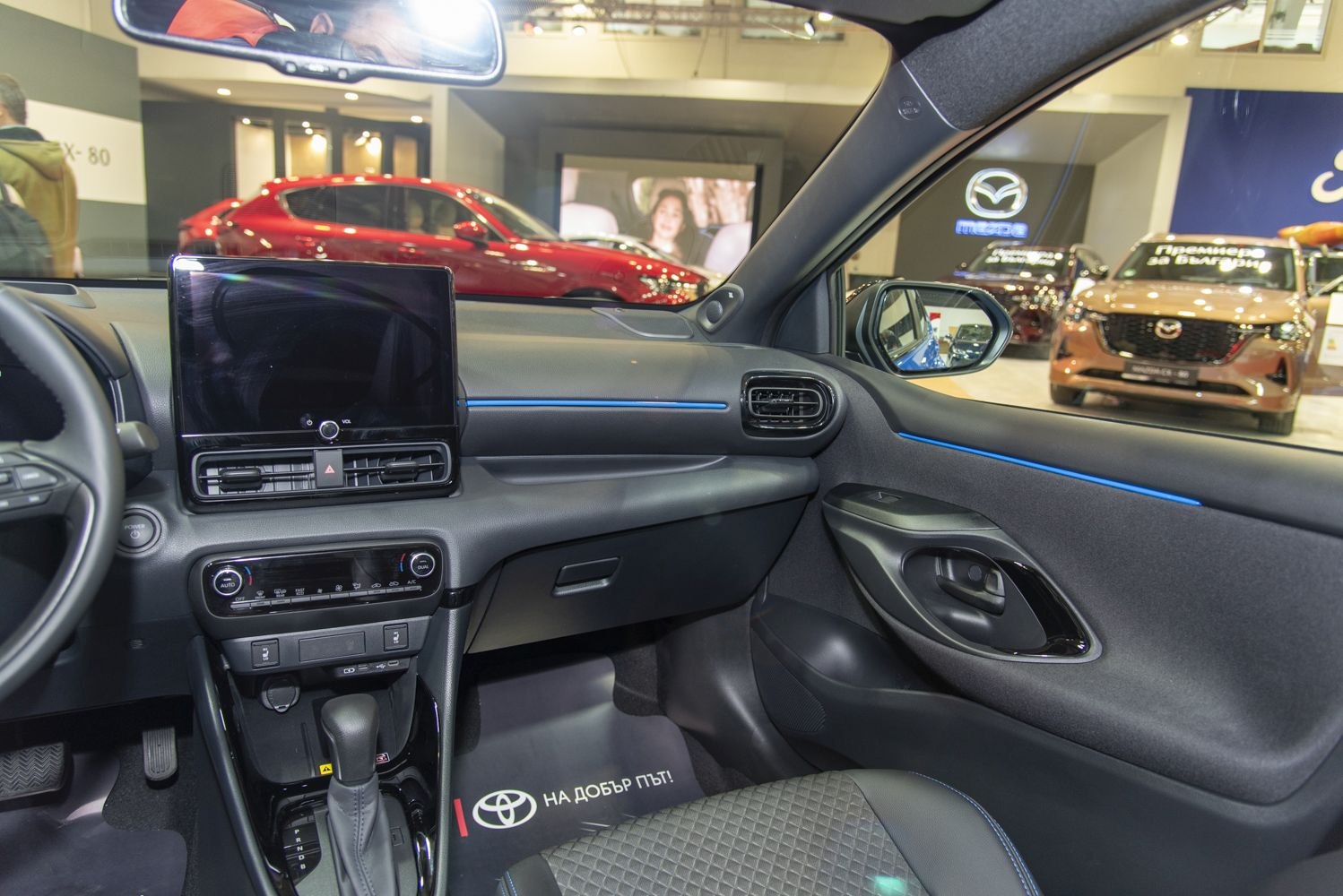 Digital display dashboard and air vents inside a modern car interior