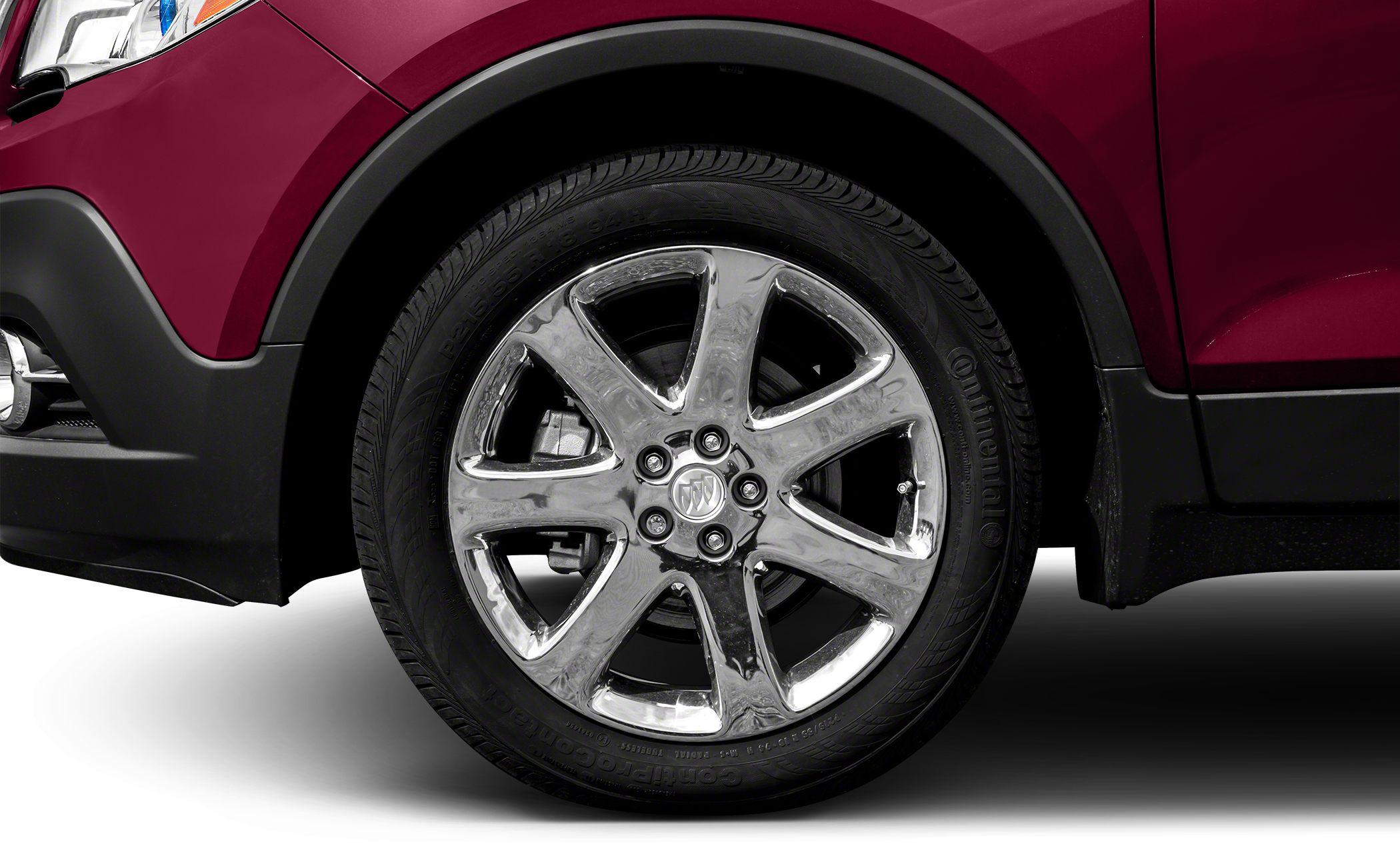 Chrome alloy wheel with tire tread close-up