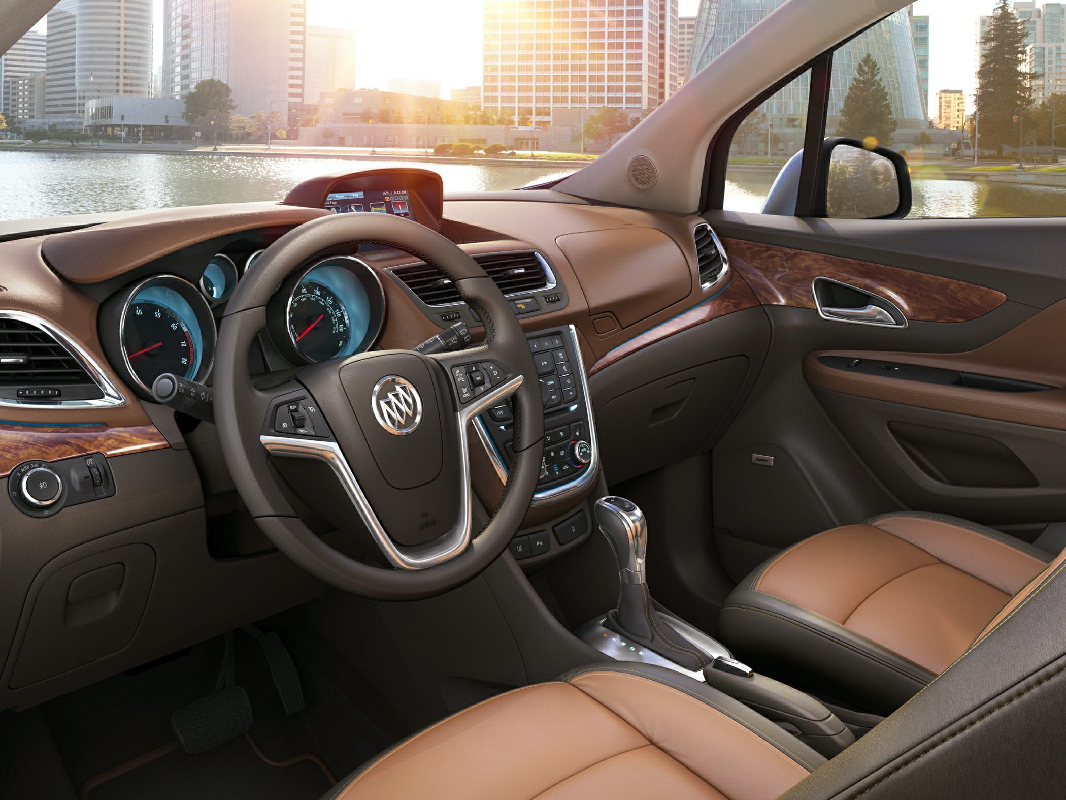 Brown leather seats and wood trim dashboard with center console and steering wheel controls