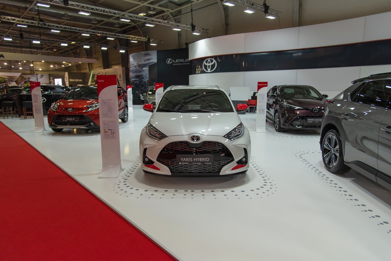 Front view of a hybrid vehicle with sporty grille and red accents.