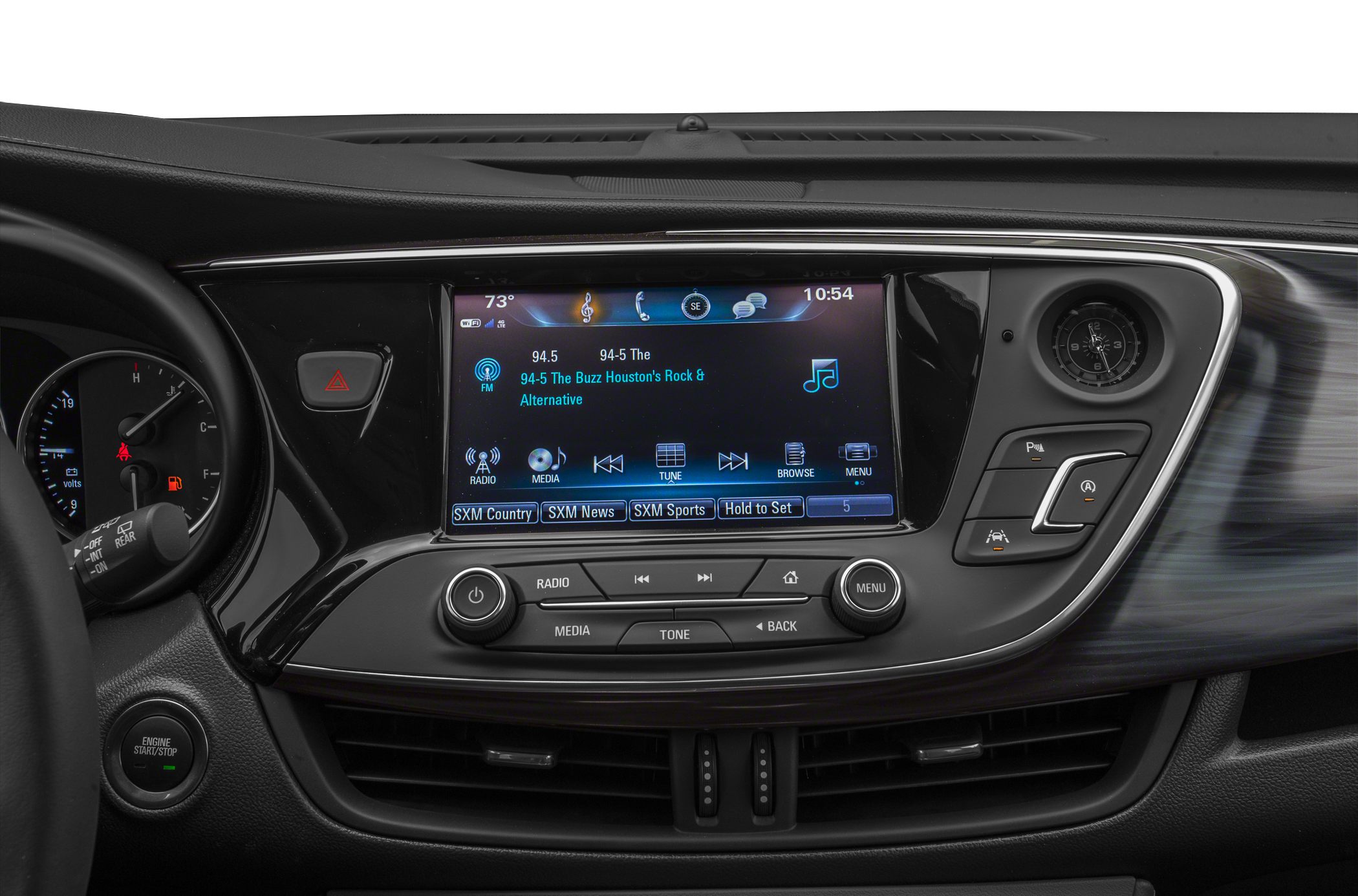 Touchscreen infotainment and analog clock on sleek dashboard
