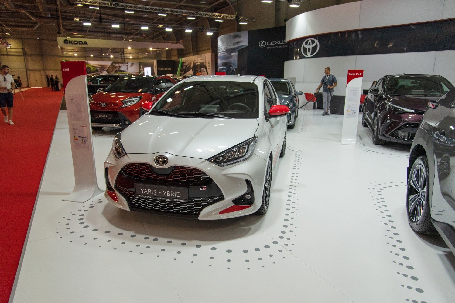 Front view of Toyota Yaris Hybrid with sporty grille and LED headlights.