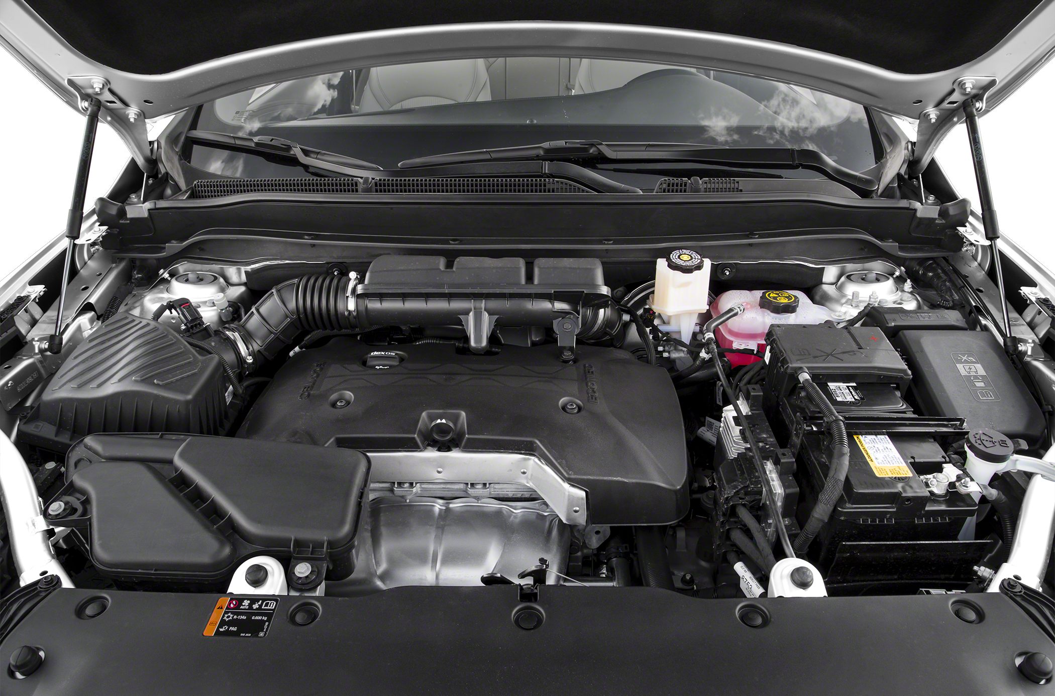 Engine bay with covered engine, air intake, battery, and fluid reservoirs
