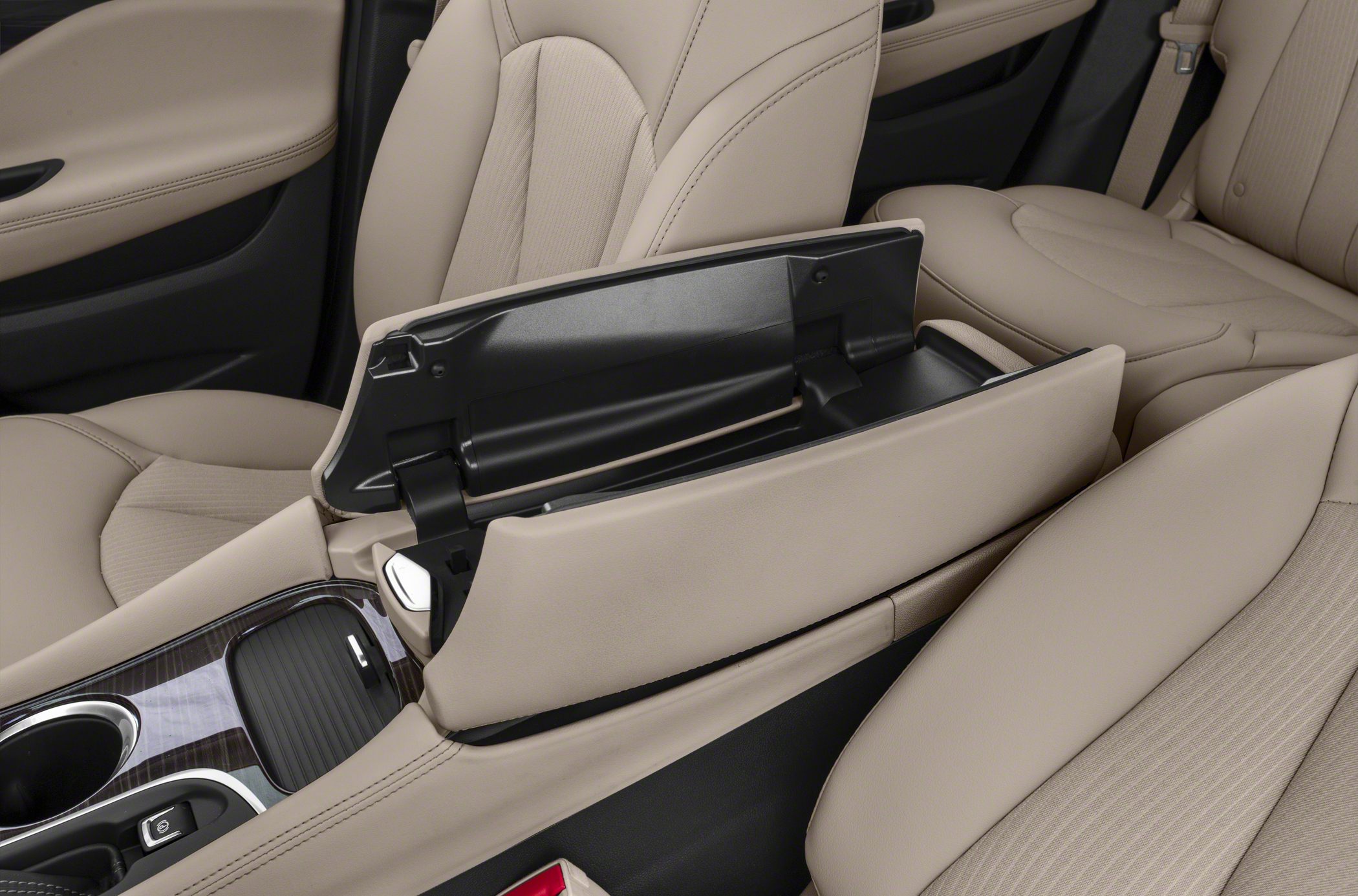 Beige front seat armrest with open storage compartment in car interior