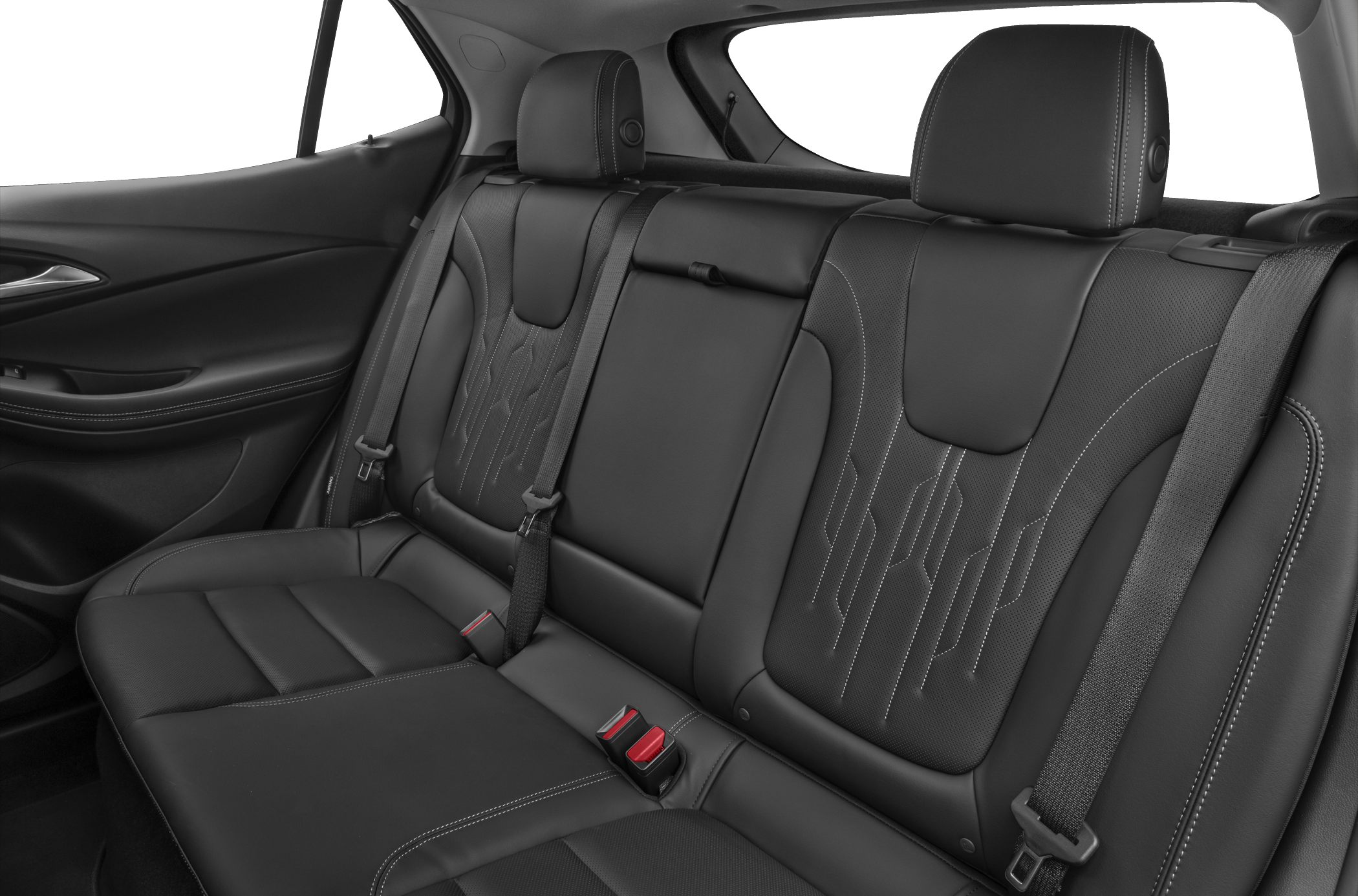 Rear leather seats with intricate stitching and seatbelts