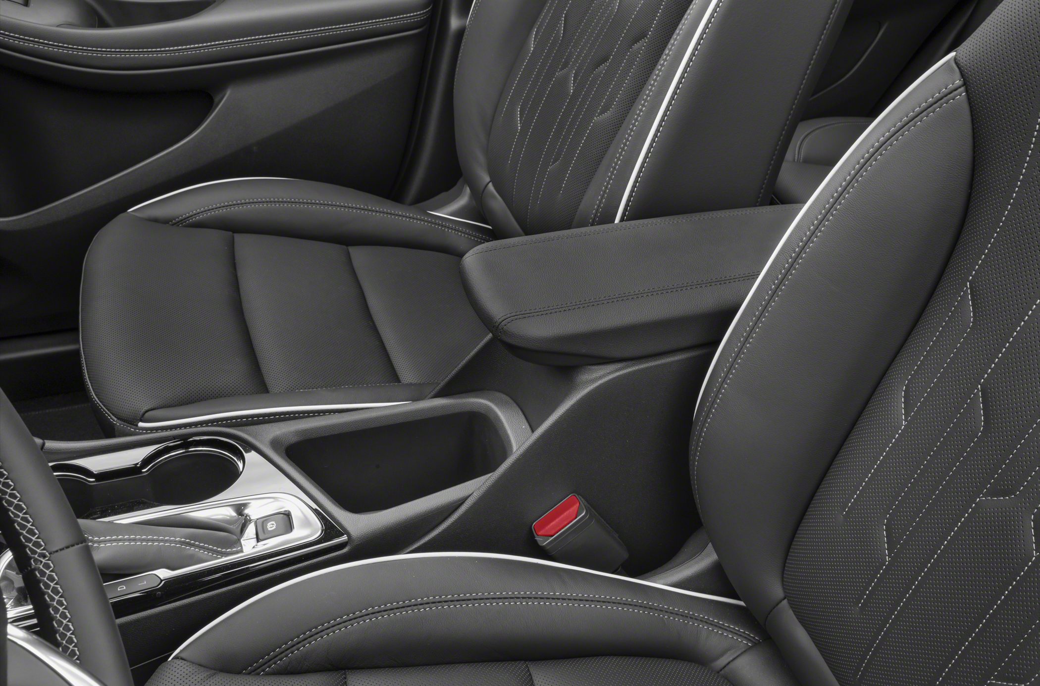 Luxury leather seats with white stitching and central console with gear selector