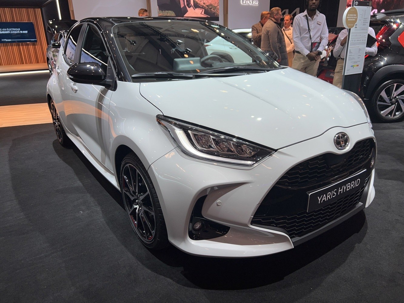 Sleek front headlights and sporty side profile with black roof