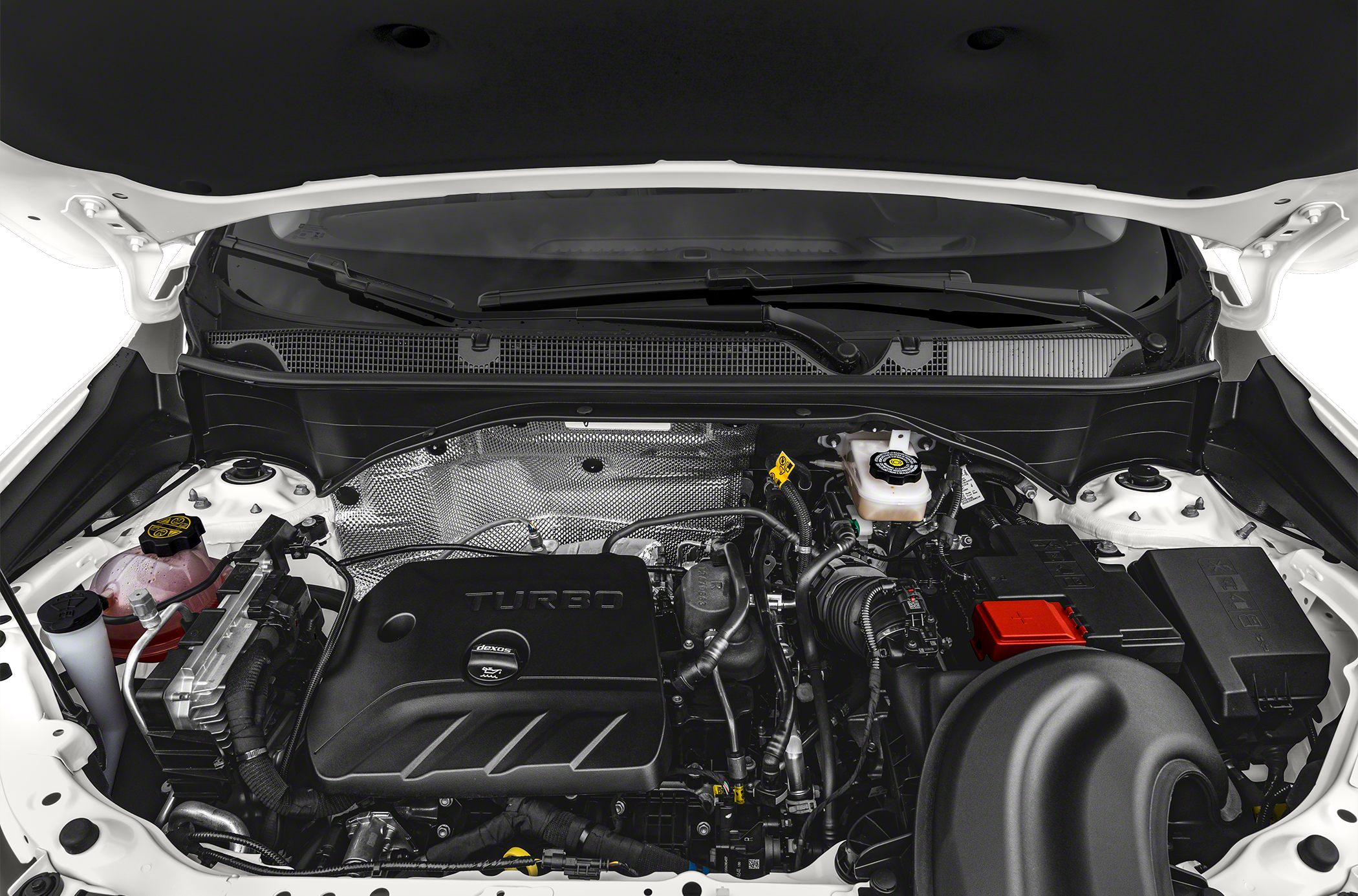 Close-up of turbocharged engine bay with components and fluid reservoirs