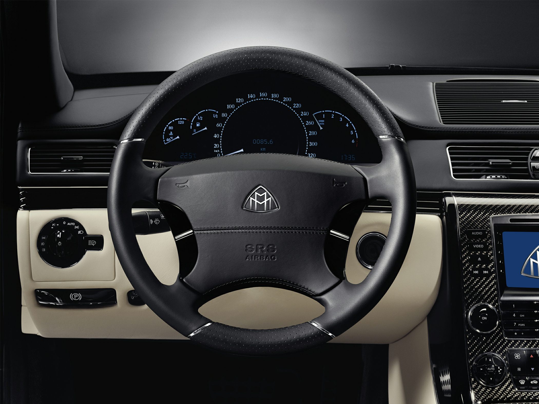Luxury steering wheel and detailed dashboard with carbon fiber trim