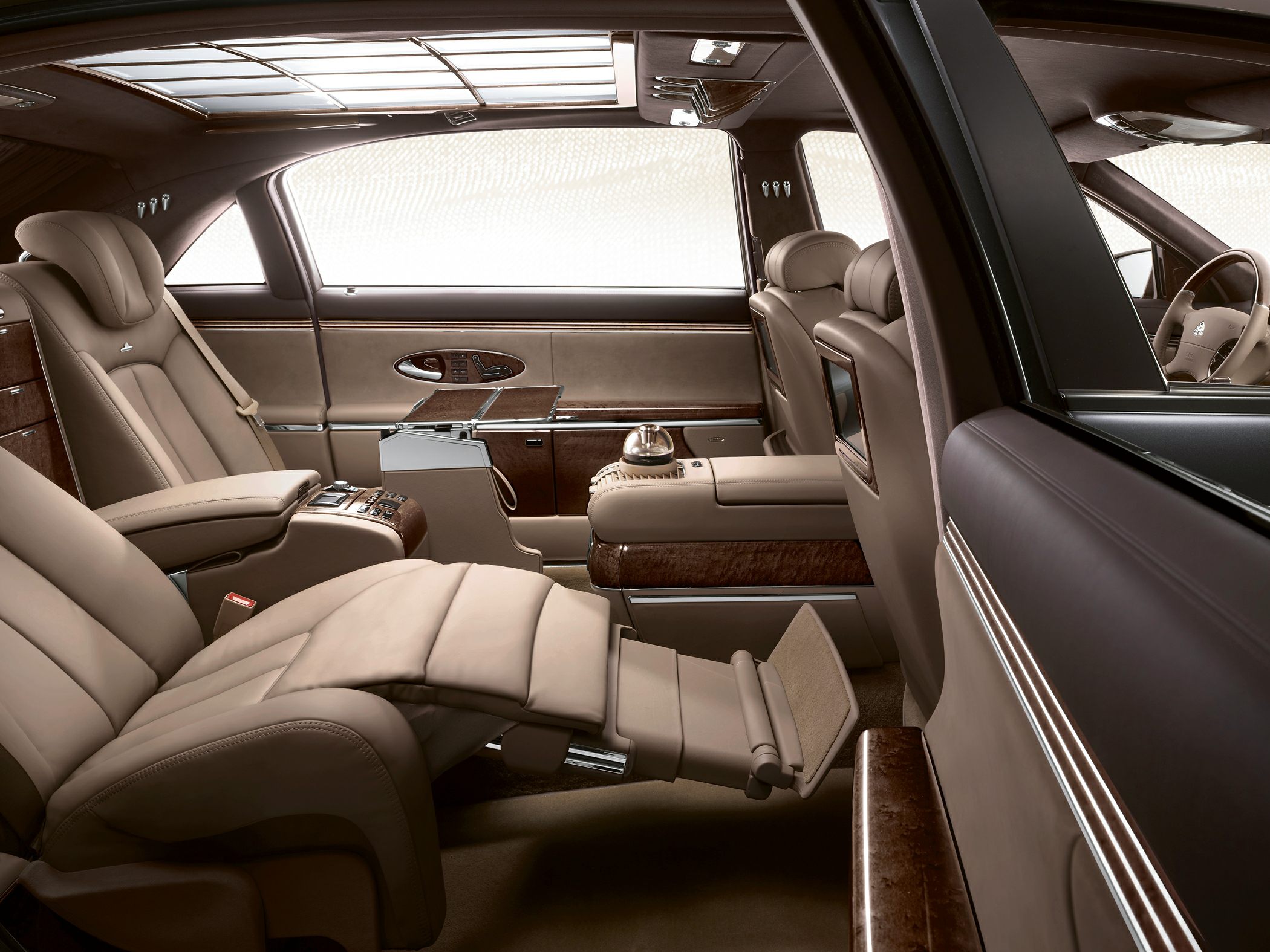 Luxury beige leather reclining rear seat with wood trim and panoramic roof