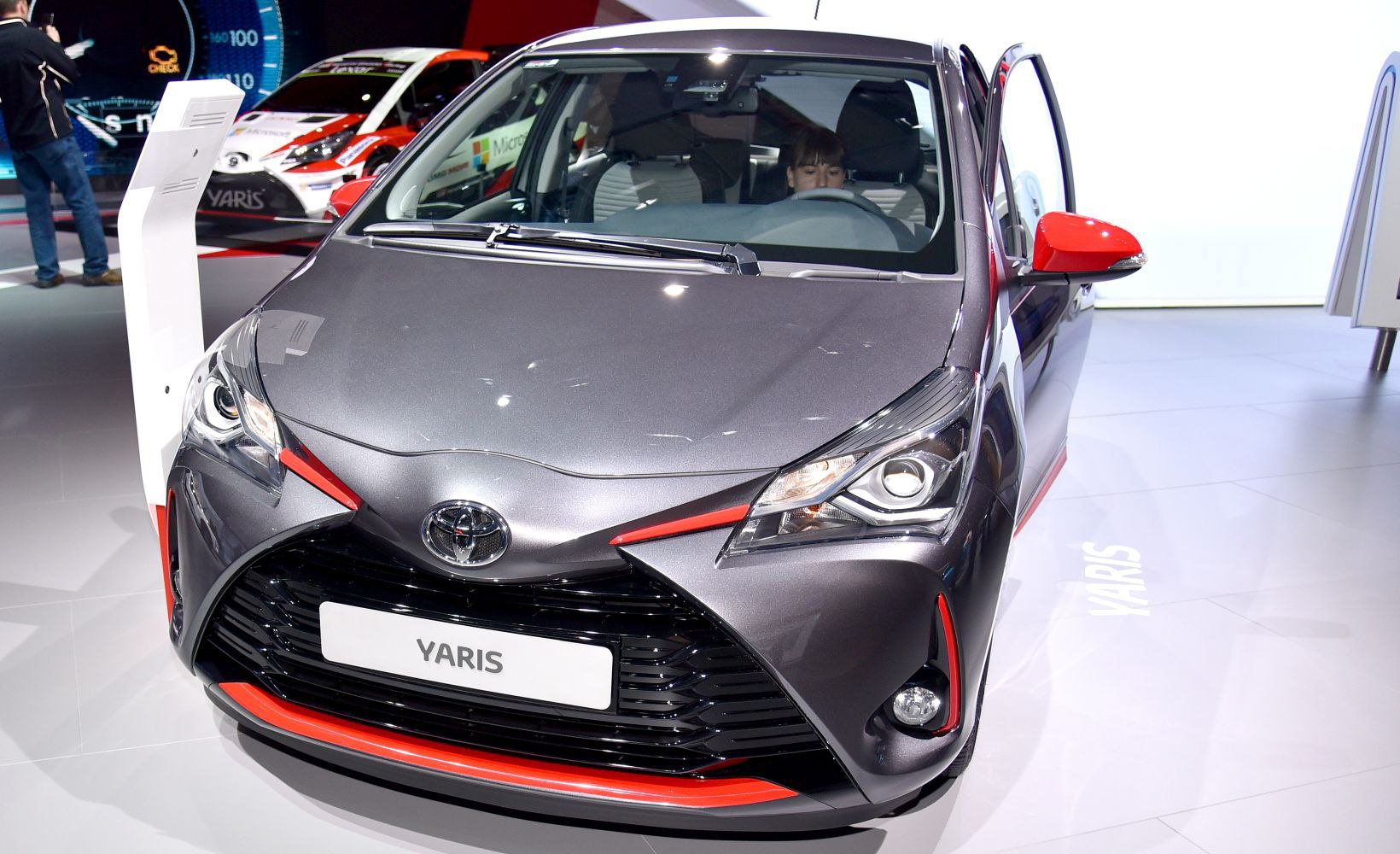Front view with LED headlights and sporty grille featuring red accents