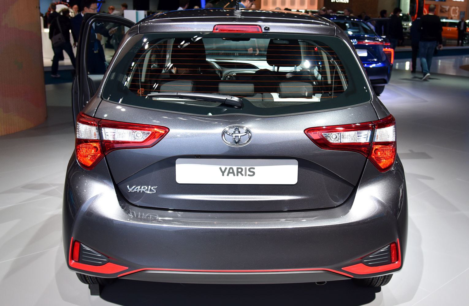 Rear view with distinctive tail lights and rear window wiper